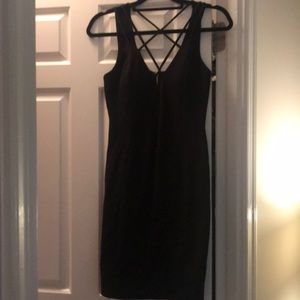 Crossed knee length black dress